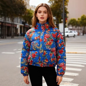 Women's floral print quilted puffer jacket with vibrant blue pattern and stand collar