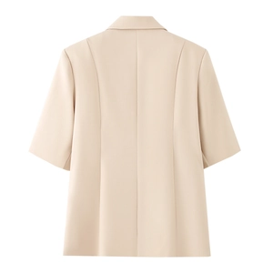 Back view of a cream short sleeve blazer with a belted waist and tailored seams