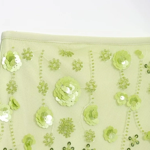 Light green mesh crop top featuring 3D sequin flowers and detailed beadwork embroidery
