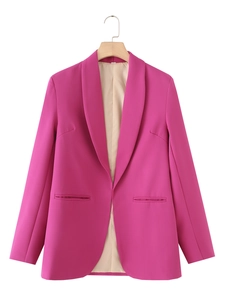 Detail of fuchsia shawl collar blazer showing premium smooth fabric and beige inner lining