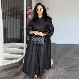 Elegant black puff sleeve midi dress with button-up collar and voluminous silhouette
