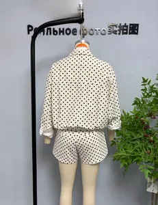 Rear view of polka dot seersucker jacket and shorts set on mannequin display