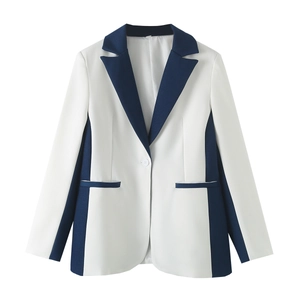 Detail view of office blazer with navy contrast piping and single button closure