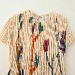 Floral cactus print smocked dress in beige with back keyhole closure and elastic texture