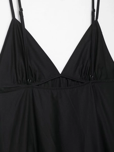 Detail of black V-neck midi dress featuring hollow-out design and adjustable straps