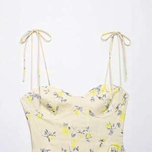 Floral print tie-strap sweetheart neckline corset top in light yellow poplin fabric
