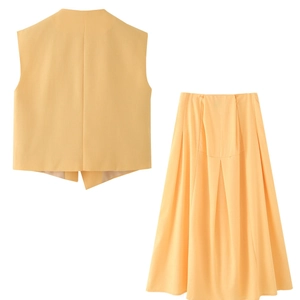 Women's two-piece set featuring a yellow cotton linen vest and irregular long skirt