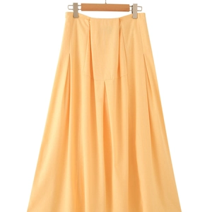 Elegant high-waisted apricot midi skirt with wide pleats and metal buckle on white background