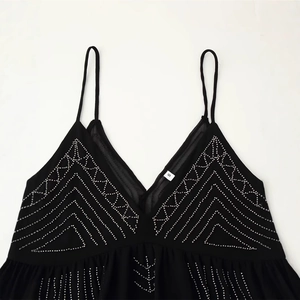 Black V-neck camisole top with silver bead embroidery and geometric chevron pattern