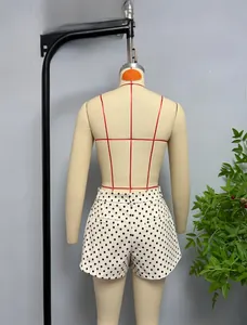Detailed back view of high-waist polka dot shorts with pocket and smooth fabric texture