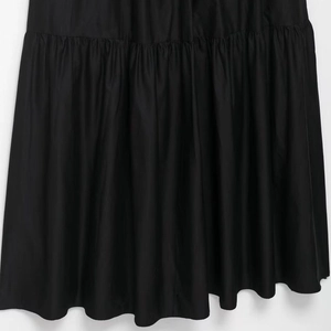 Chic black midi dress featuring a sophisticated pleated hem and contrast stitching detail