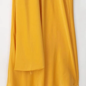 Chic bright yellow satin halter maxi dress with slim fit and elegant draped ribbon detail