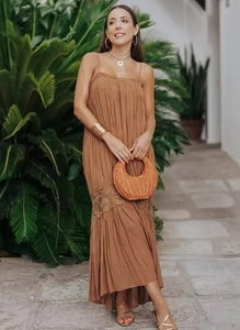 Detail of caramel pleated maxi dress featuring delicate lace waist inserts and spaghetti straps