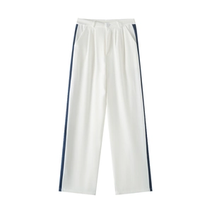 Detail of high-waisted off-white wide-leg trousers with dark blue side stripes