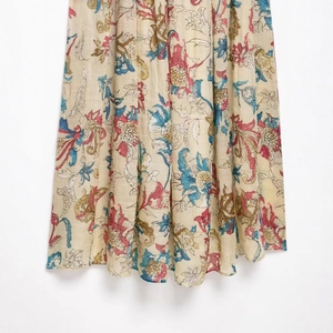 Bohemian floral ramie maxi dress featuring vintage patterns on beige fabric texture
