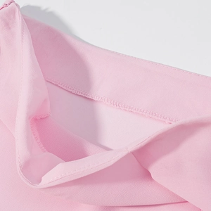 Close-up of pink chiffon skirt showing invisible zipper and fine stitching detail