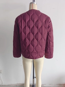 Back view of a burgundy onion-quilted jacket featuring a round neck and drawstring design