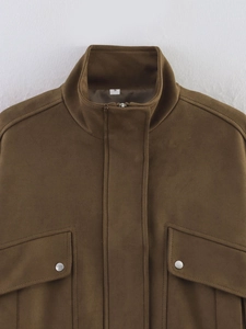 Close-up of brown suede jacket detailing silver buttons on chest pockets and S size label