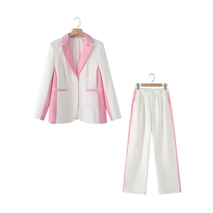 Women's two-piece suit with contrast white and pink blazer and straight-leg trousers