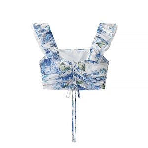 Detailed view of floral crop top with square neckline, ruffle sleeves and ruched front tie