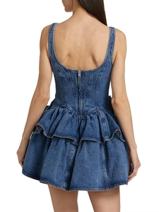 Detailed back view of a denim mini dress featuring a corset bodice and layered ruffled hem