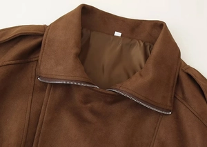 Close-up of brown faux suede jacket collar with silver metal zipper and smooth inner lining
