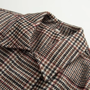 Women's plaid bomber jacket featuring a classic houndstooth pattern and padded texture