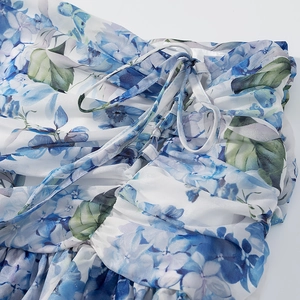 Detail of floral chiffon fabric with blue hydrangea print and adjustable drawstring waist