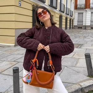 Women's dark brown quilted drawstring jacket with classic onion skin stitching design