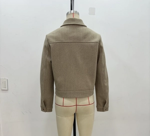 Back view of a cropped camel tweed jacket featuring a classic collar and back seam detail