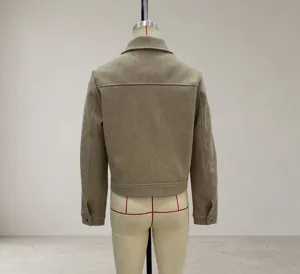 Back view of a cropped camel tweed jacket featuring a classic collar and back seam detail