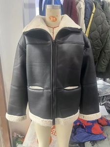 Detail of faux leather aviator jacket with contrasting cream faux shearling collar and cuffs