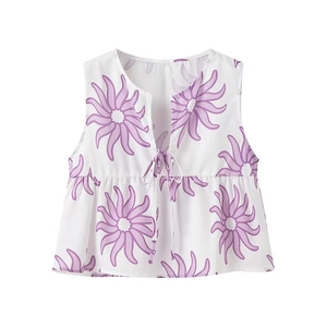 Detail of V-neck sleeveless top with purple floral print and front drawstring ties
