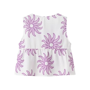 Close-up of sleeveless V-neck top with purple sunburst floral print and ruffled hemline
