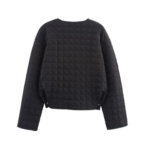 Rear view of a black quilted short jacket showing square stitching and nylon texture