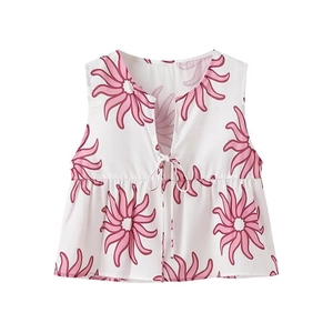 Detail of floral V-neck sleeveless top with front tie closure and ruffled hemline