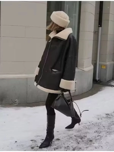 Winter faux leather shearling jacket with plush collar and matching fur hat outfit
