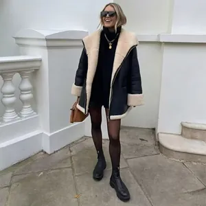 Chic black faux leather shearling coat with oatmeal fur lining and stylish oversized lapels