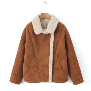 Detailed view of brown faux suede jacket with plush white sherpa lining and large pockets
