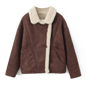Close-up of the vintage faux shearling lining and dark brown suede fabric texture