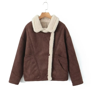 Detail of vintage faux suede jacket with warm sherpa lining and asymmetrical button closure