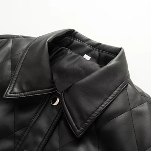 Detailed view of black quilted PU leather jacket collar with metal snap buttons