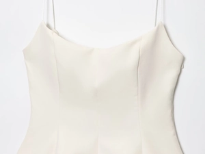 Detail of white spaghetti strap top with invisible zipper and elegant structured stitching