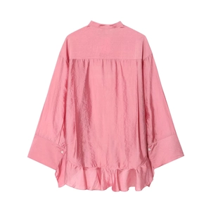 Detailed back view of a pink long-sleeve blouse with ruffles and a wavy hemline