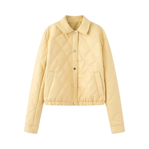 Quilted cream PU leather jacket with lapel collar and silver snap buttons in flat lay