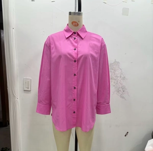 Detail of rose pink long sleeve button-up shirt with turn-down collar and pleat details