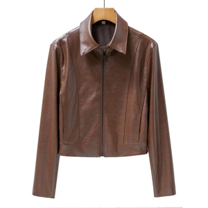 Brown faux leather jacket with lapel collar and cuff slits on a wooden hanger