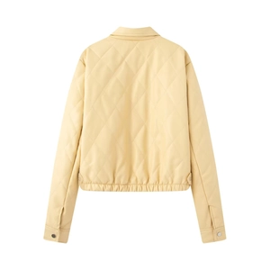 Detail view of light yellow quilted PU leather jacket back with elastic hem and collar