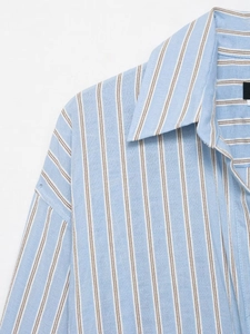 Detailed macro view of the classic lapel collar and vertical stripes on the fabric