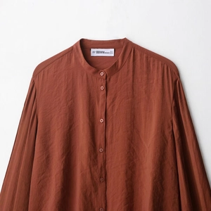 Women's loose long-sleeve shirt in rust red featuring stand collar and button-down front